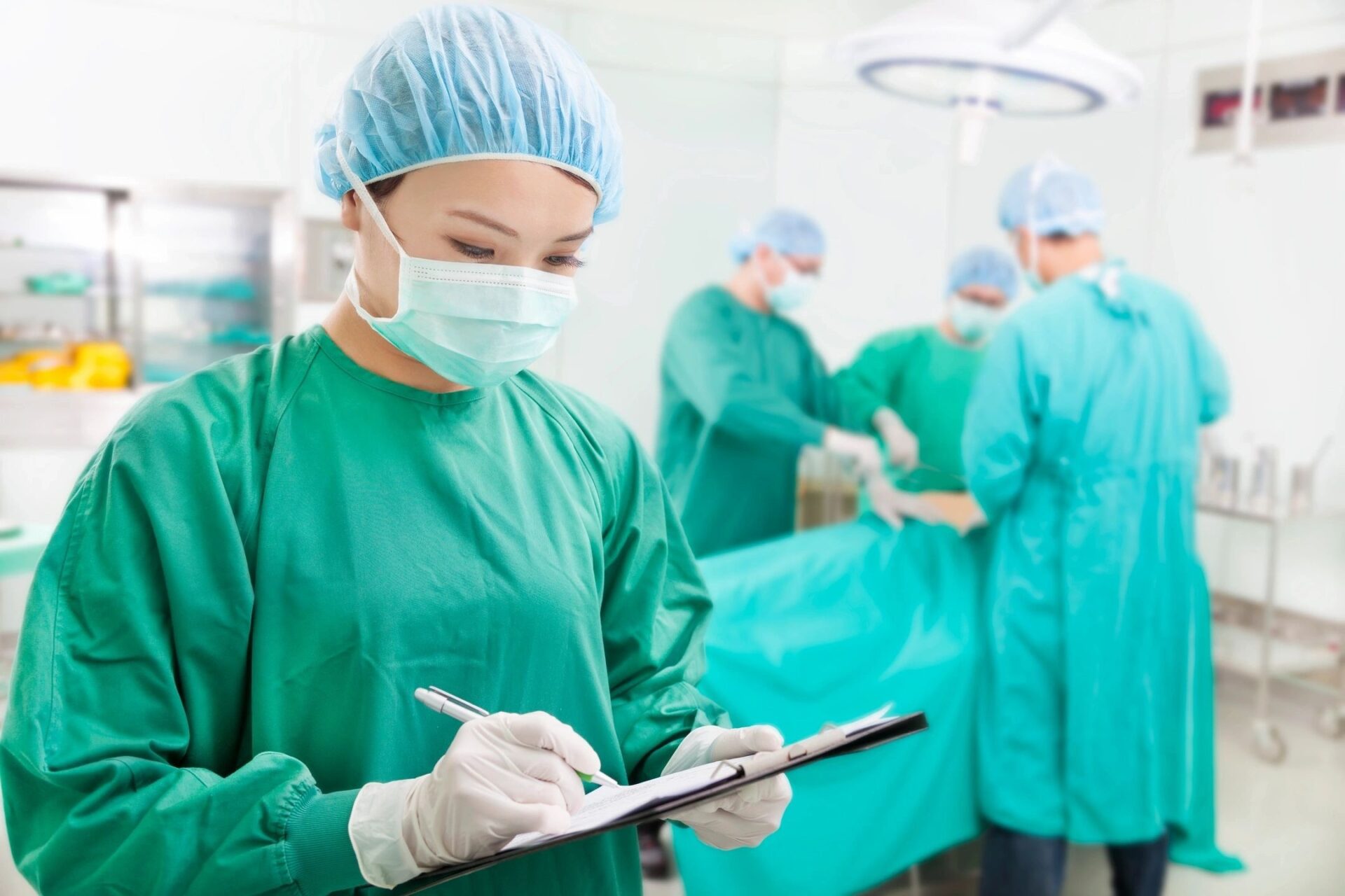 a nurse is noting down on a paper