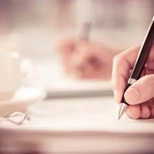 closeup shot of a hand with a pen